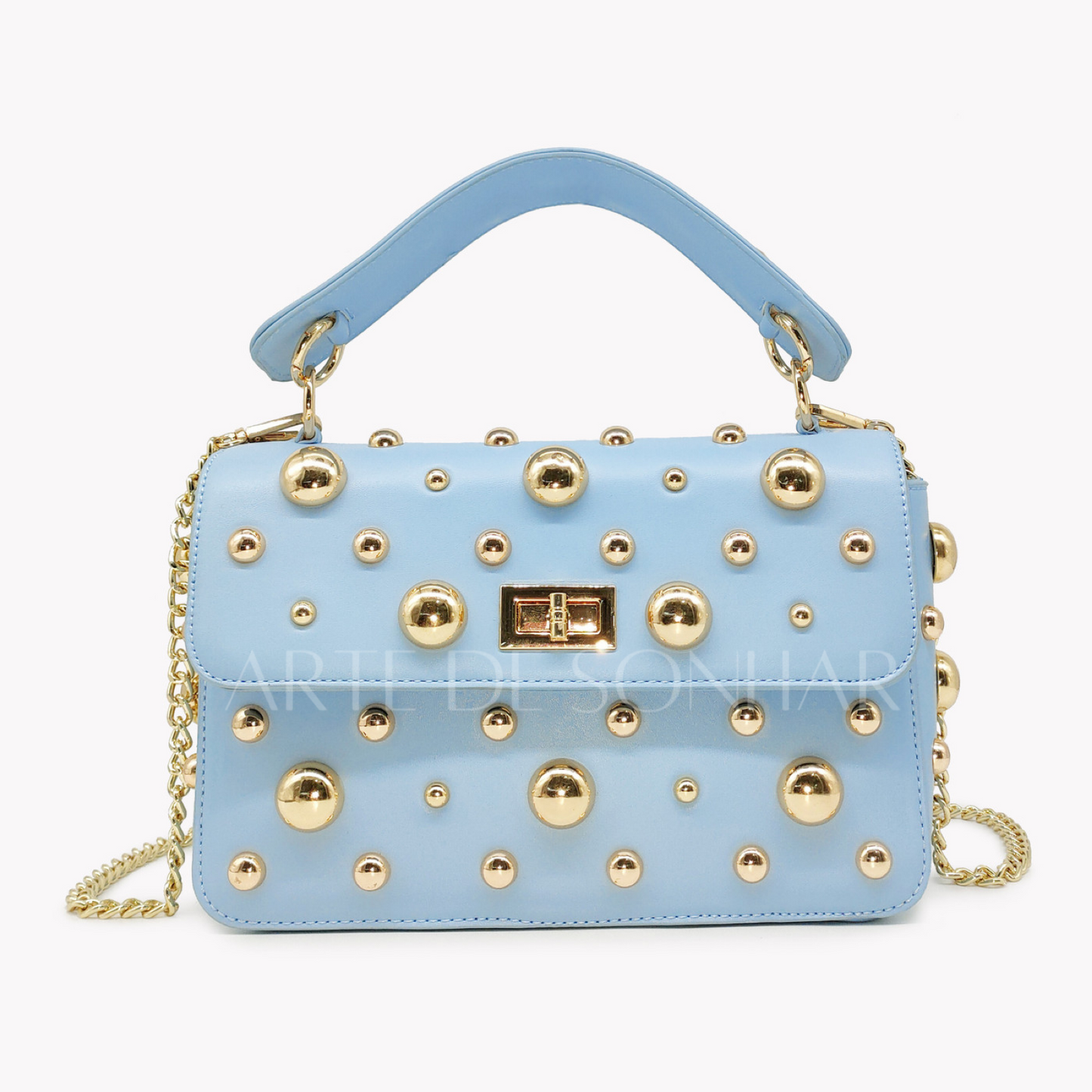 Mala azul com alça à tiracolo com tachas
