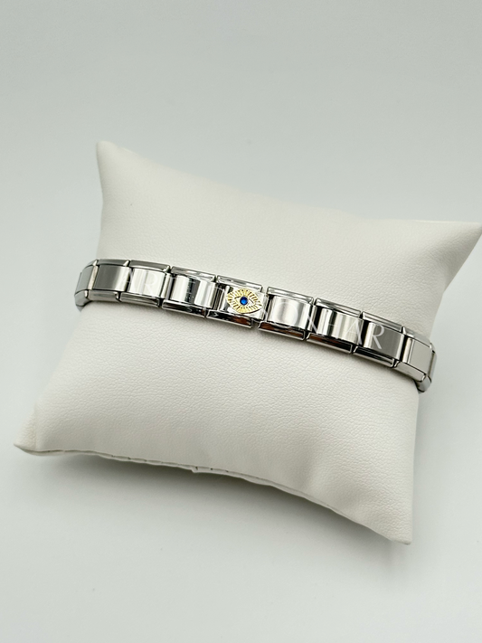 Pulseira Itália com olho dourado e cristal azul