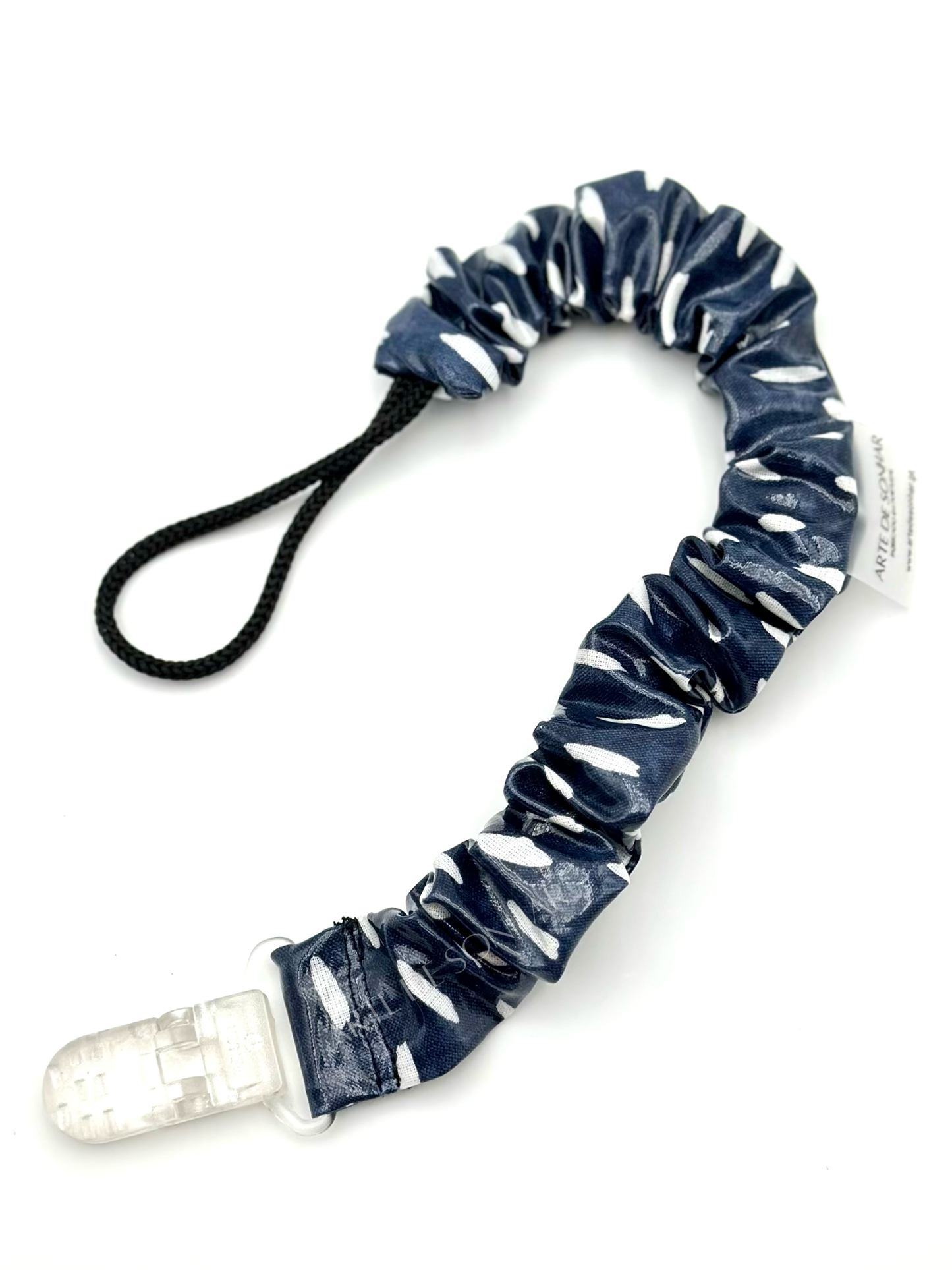 Prendedor de chucha azul com pintas brancas