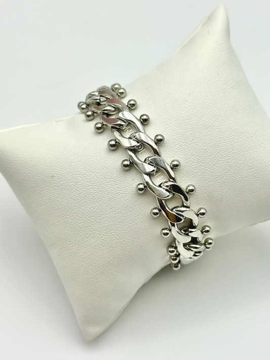 Pulseira prateada de malha aberta média com bolinhas