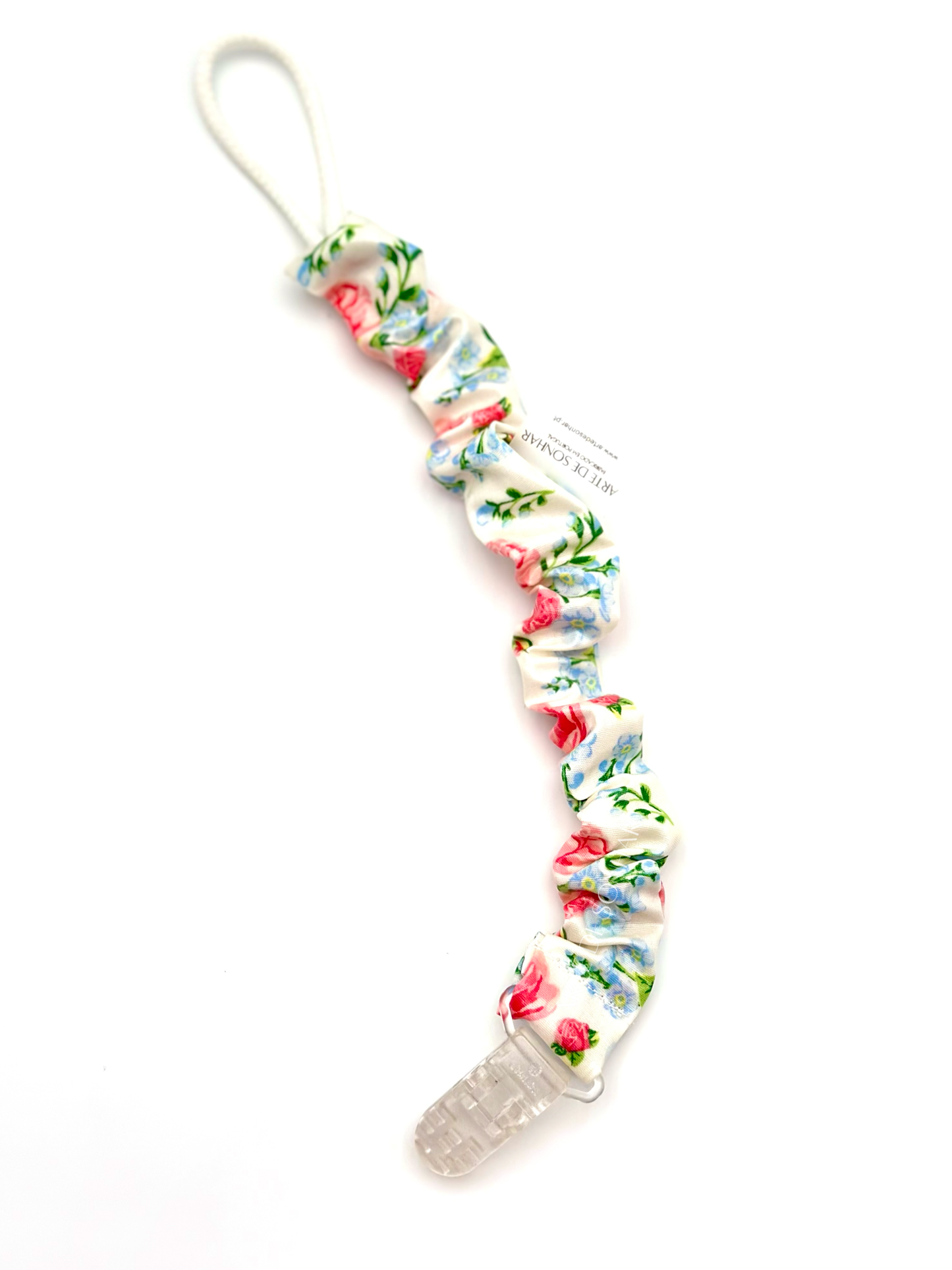 Prendedor de chucha branco com flores