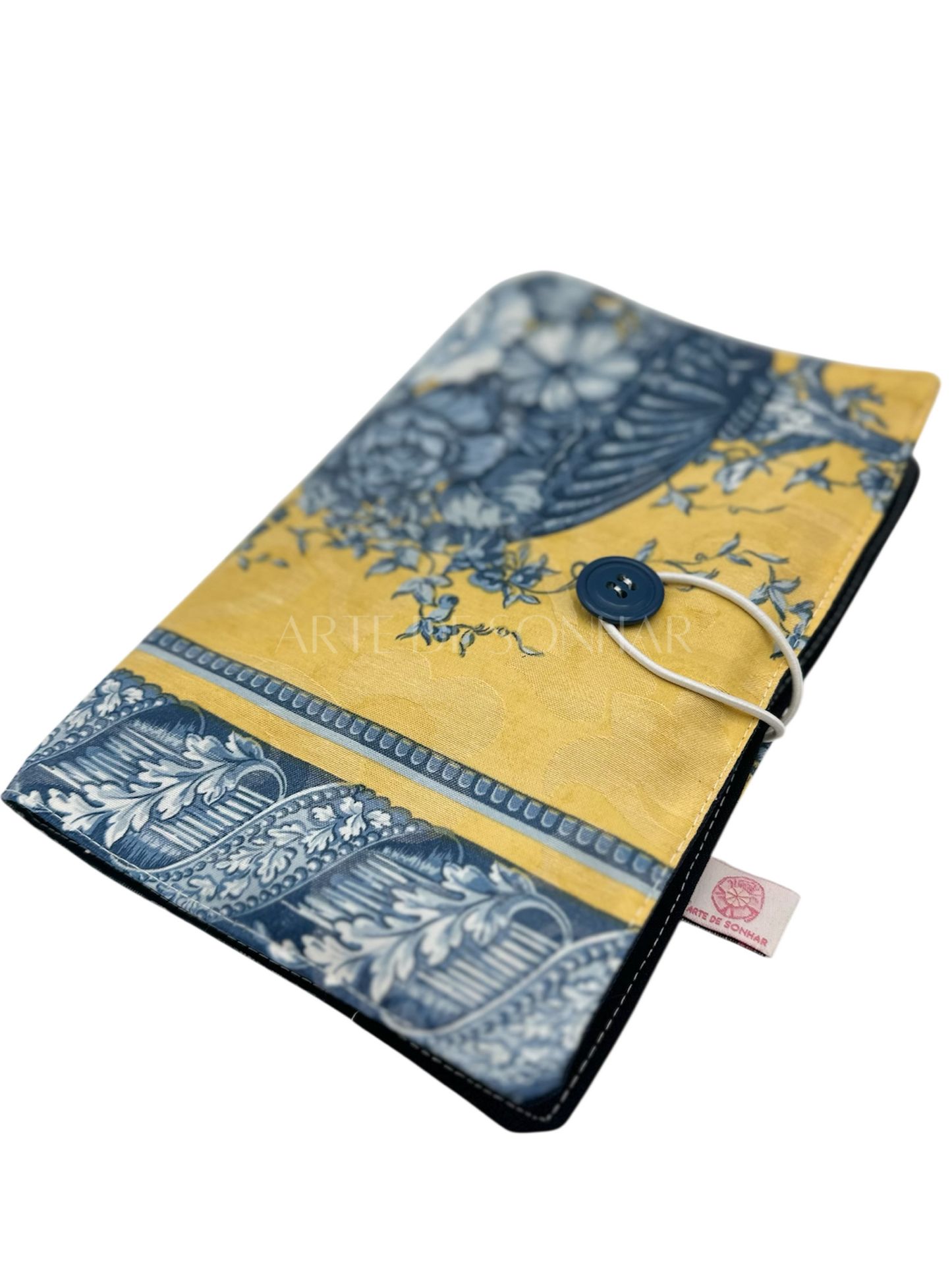 Capa de livro amarela com flores azuis