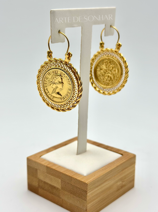 Brincos arrecadas com libra