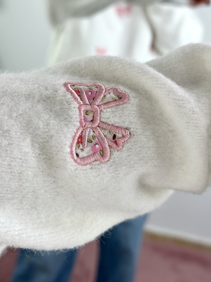 Camisola de malha branca com laços e flores