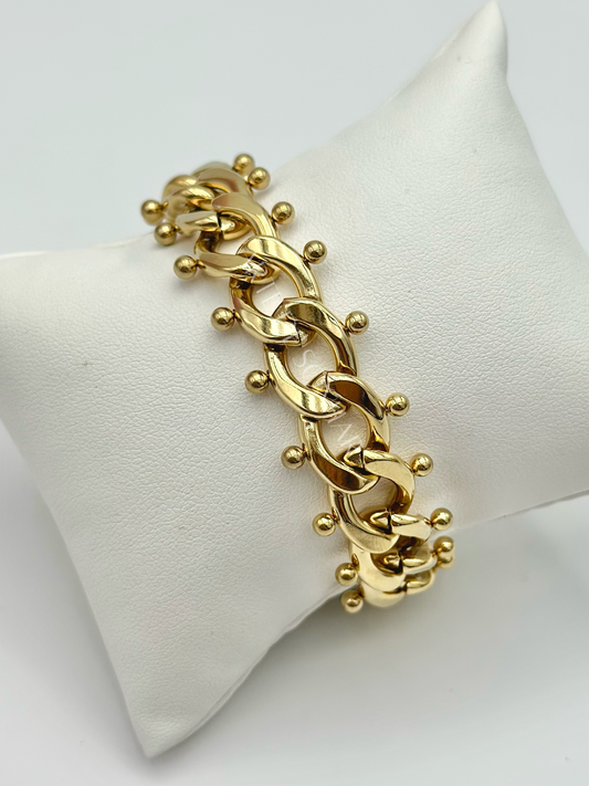 Pulseira dourada de malha aberta grande com bolinhas