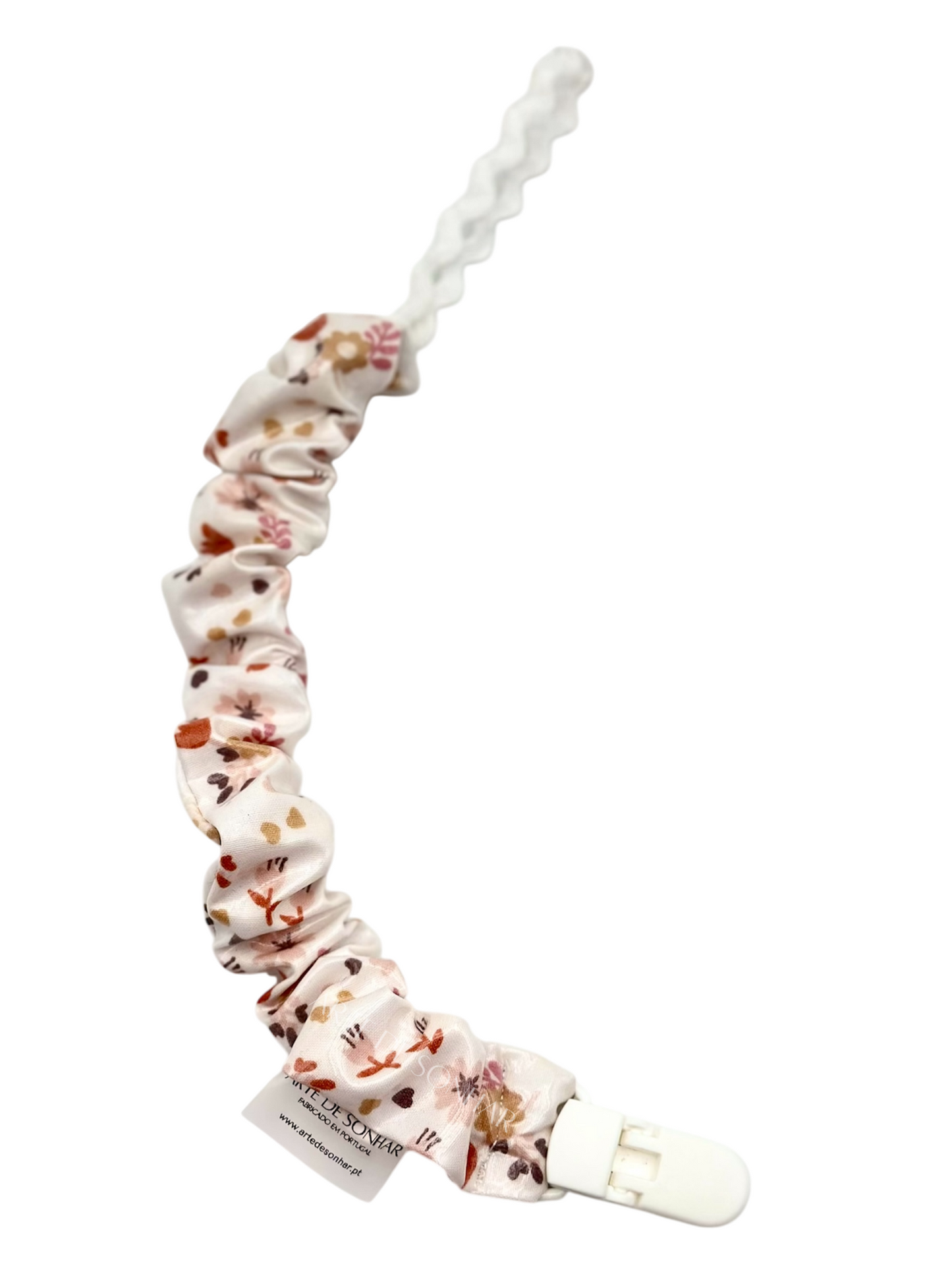 Prendedor de chucha branco com flores neutras